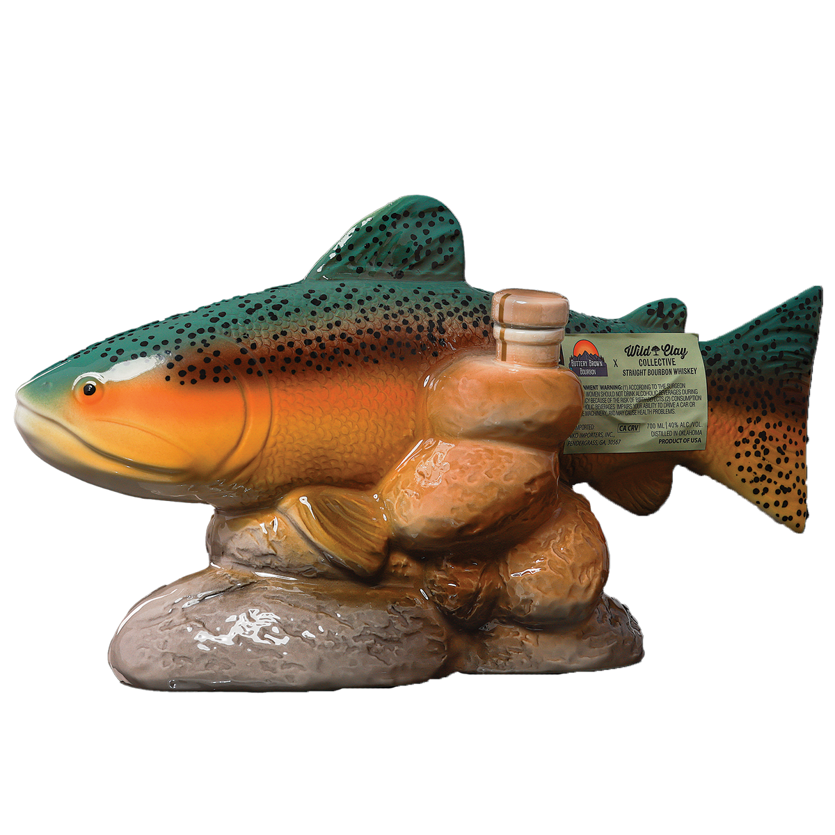 Wild Clay Collective x Buttery Brown Bourbon in a fish bottle sittling on rocks